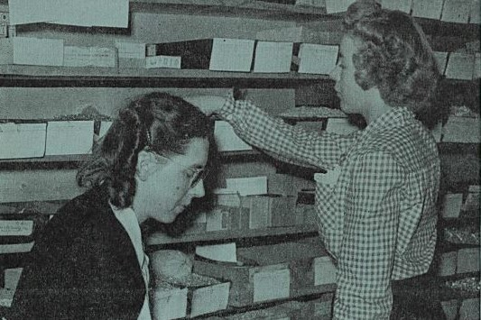 Cover of Watt's Current from May 24, 1946 featuring Billie Howard and Marge Normal working in the stockroom.